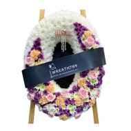 ธารา 9333 ดอกไม้สดพวงหรีดทรงวงรี โทนหนักสีม่วง